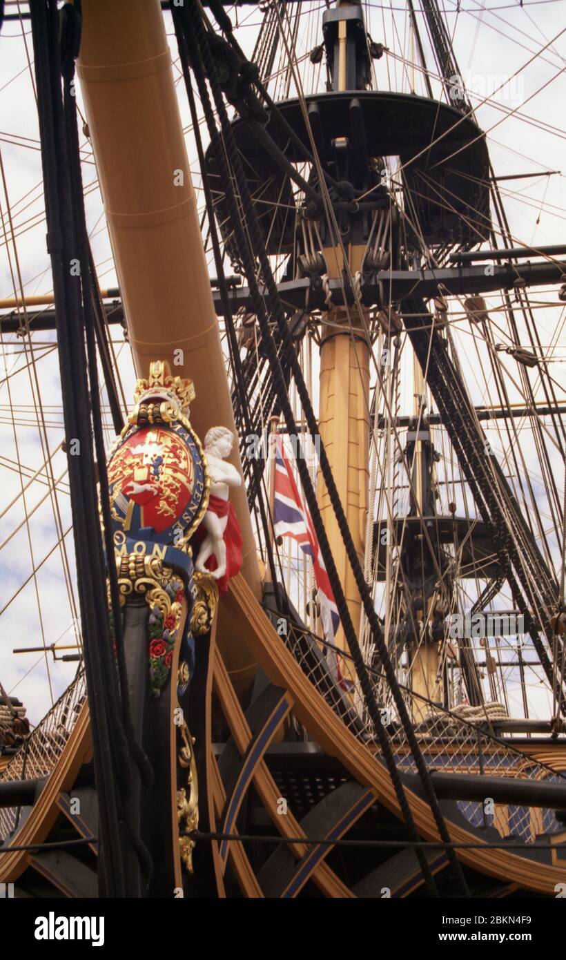 H.M.S. Victory in Portsmouth Historic Dockyard, Hampshire, England, seen in close-up from fine on the port bow.  Detail of figurehead and bow.  Shot taken in 2010 before the removal of the topmasts for restoration in 2011 Stock Photo