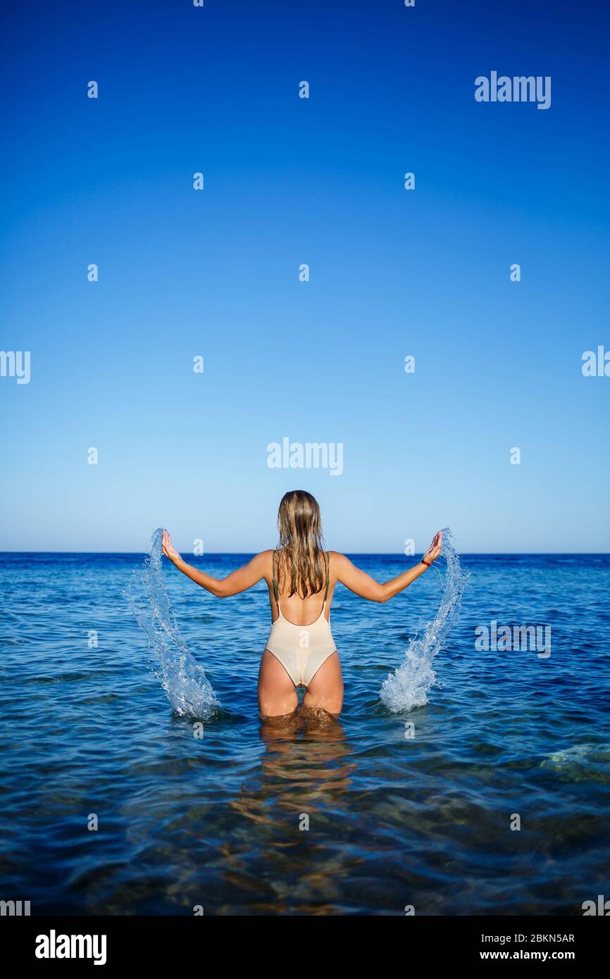 Woman diver red swimsuit hires stock photography and images Alamy