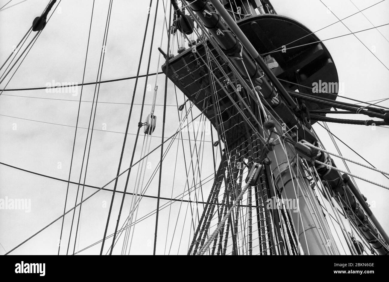 H.M.S. Victory, Nelson's flagship at the Battle of Trafalgar in No. 2 Dry Dock, Portsmouth Naval Base, Hampshire, England: close-up of one of the fighting tops, showing mast and rigging before the removal of the topmasts for restoration in 2011.  Black and white film photograph Stock Photo