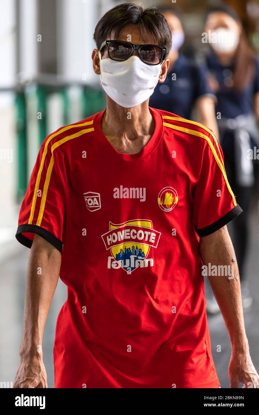 Thai man wearing face mask during Covid 19 pandemic, Bangkok, Thailand