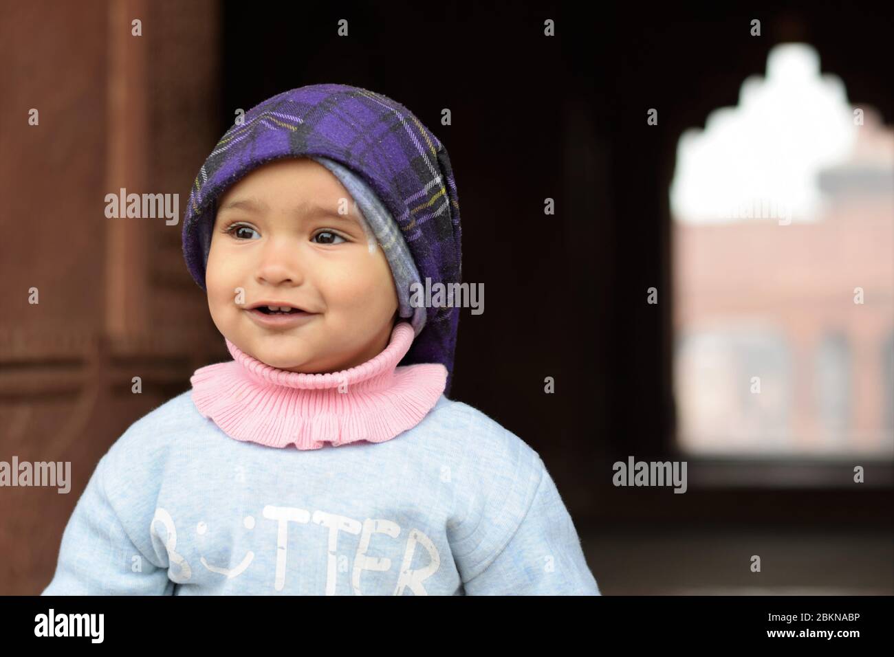 cute baby girl wearing head scarf smiling Stock Photo Alamy