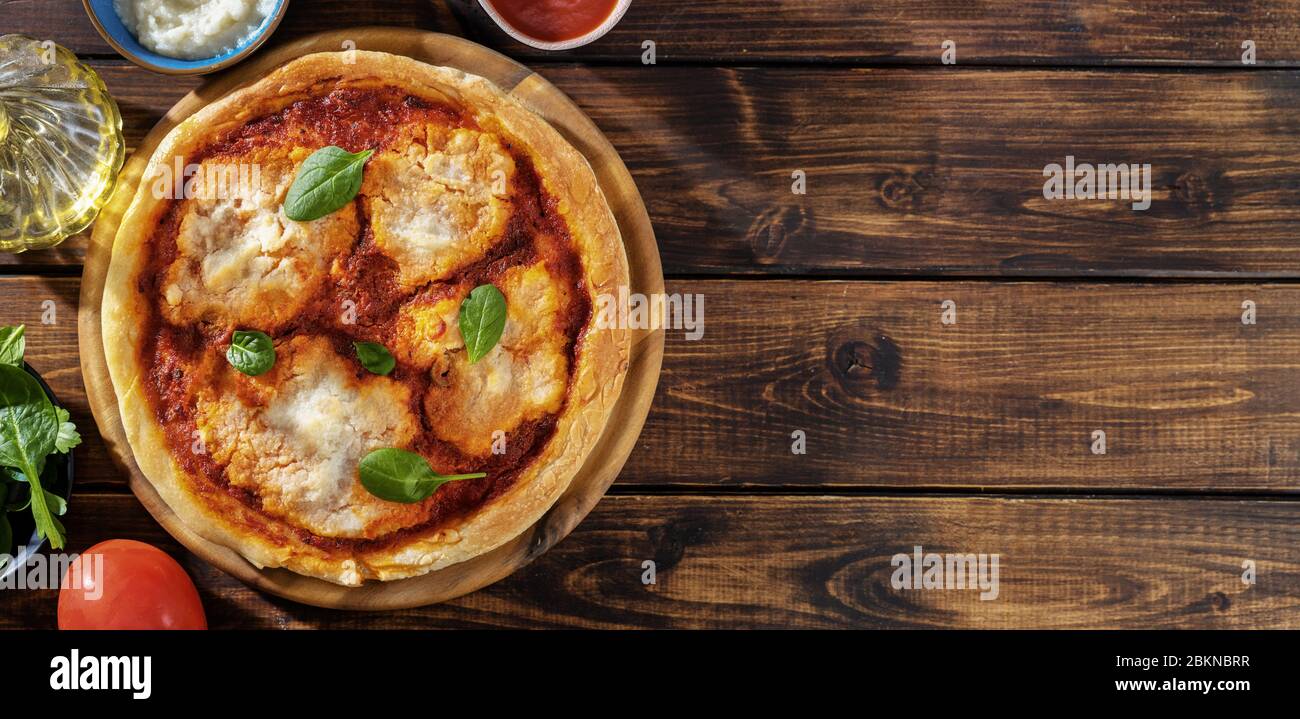 Top view of vegan pizza margherita with cauliflower creamy sauce Stock Photo