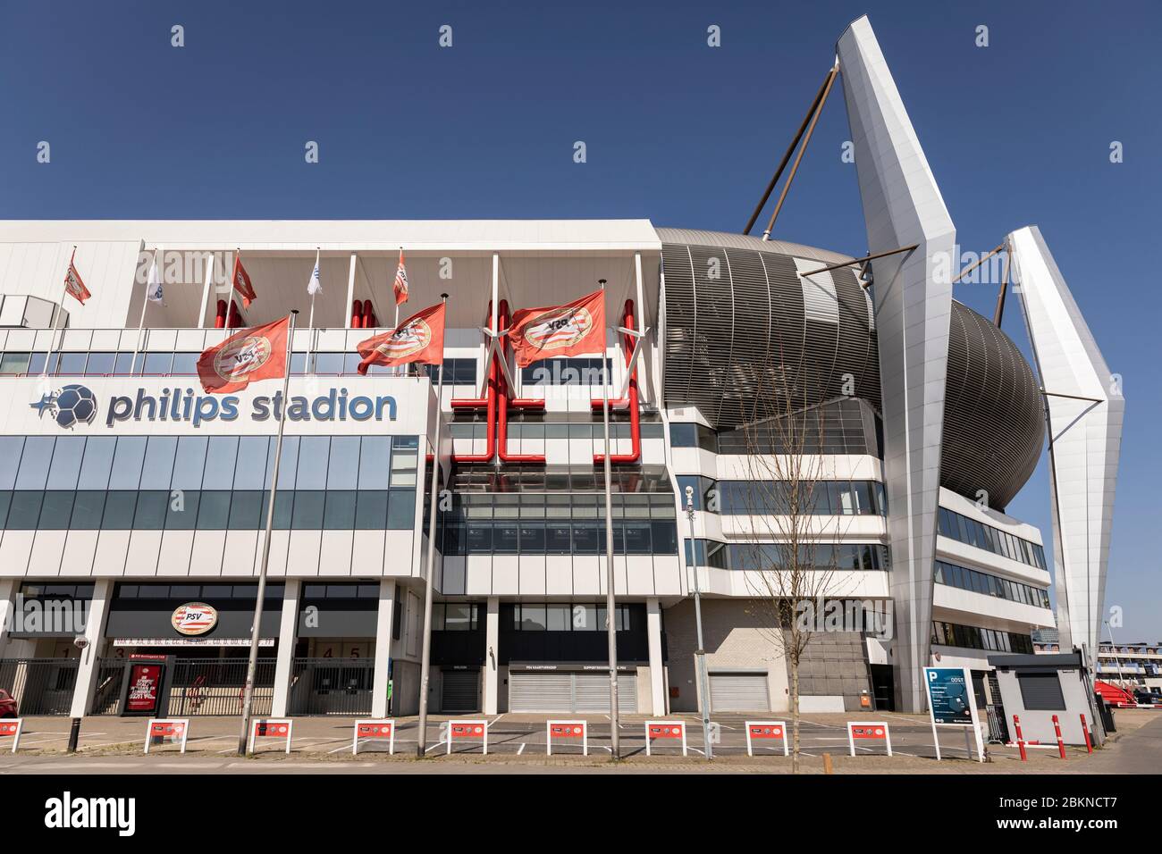 Eindhoven, The Netherlands, April 21st 2020. Exterior facade of the Philips Stadion, the third-largest Dutch football stadium in the country on a sunn Stock Photo