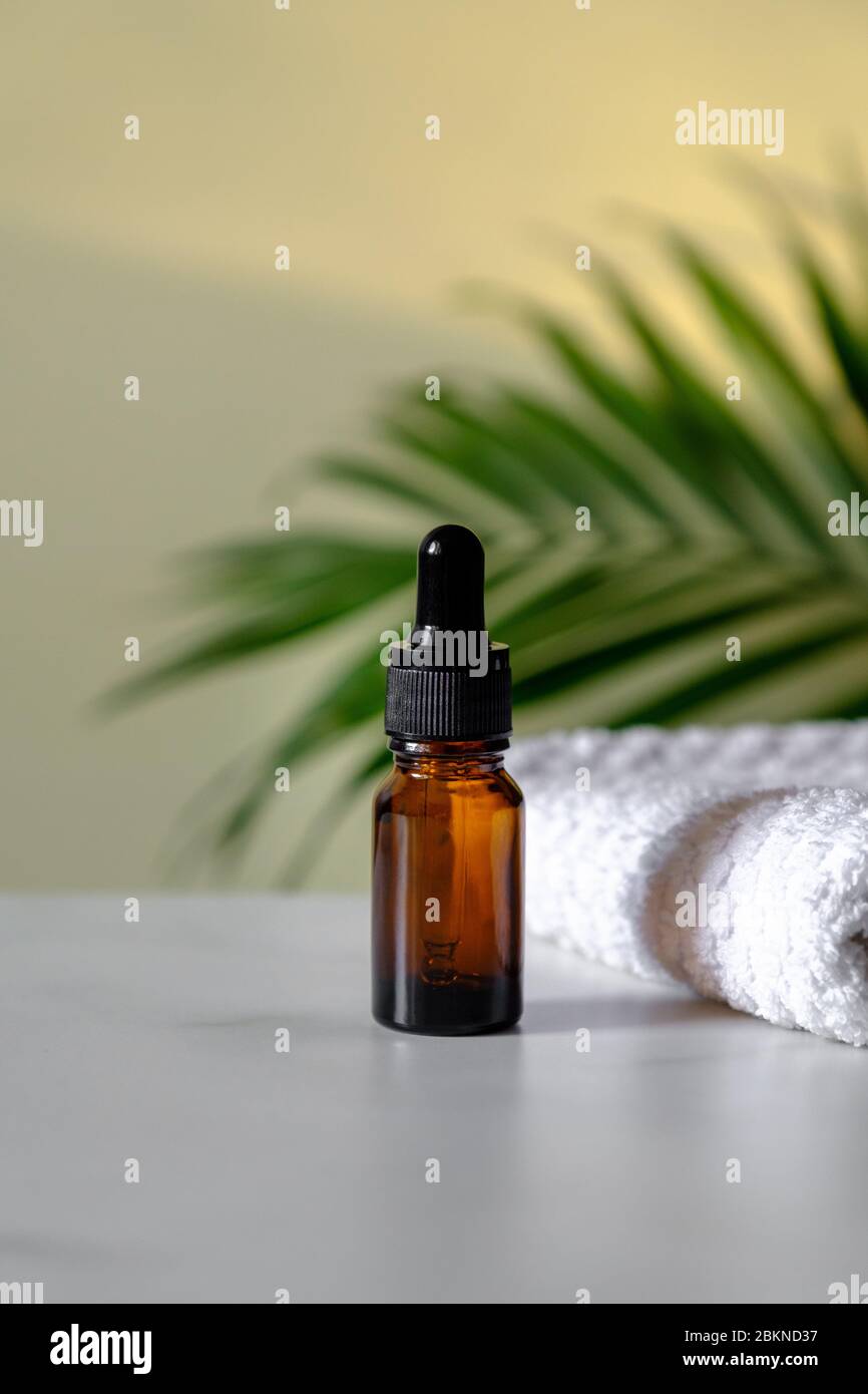 Download Amber Glass Dropper Bottle And Towel On Marble Table Tropical Palm Leaf On Background Luxury Container Mockup For Essential Oil Serum Organic Cosm Stock Photo Alamy