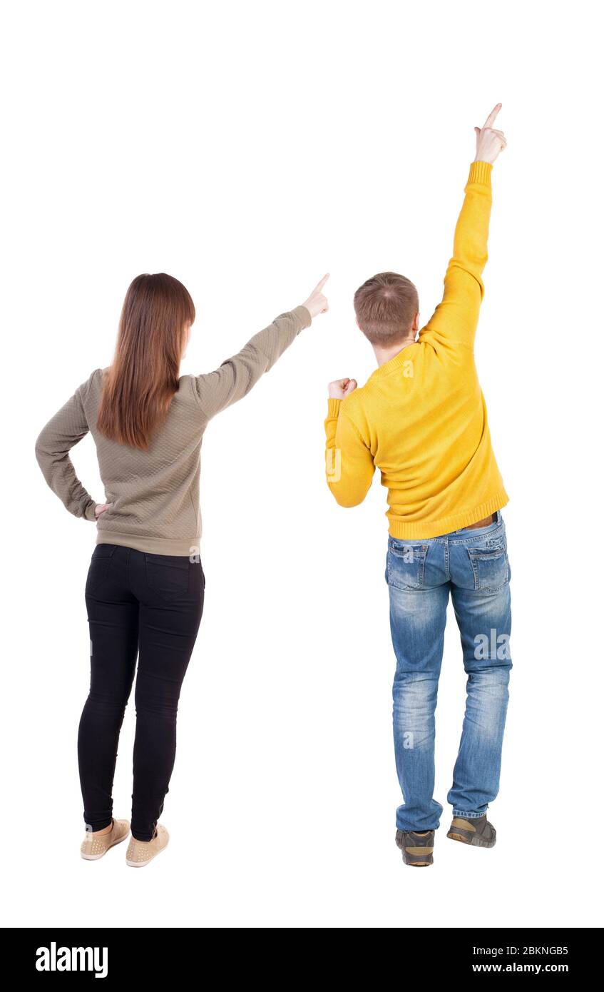 Back view of couple in sweater pointing. Rear view people collection ...