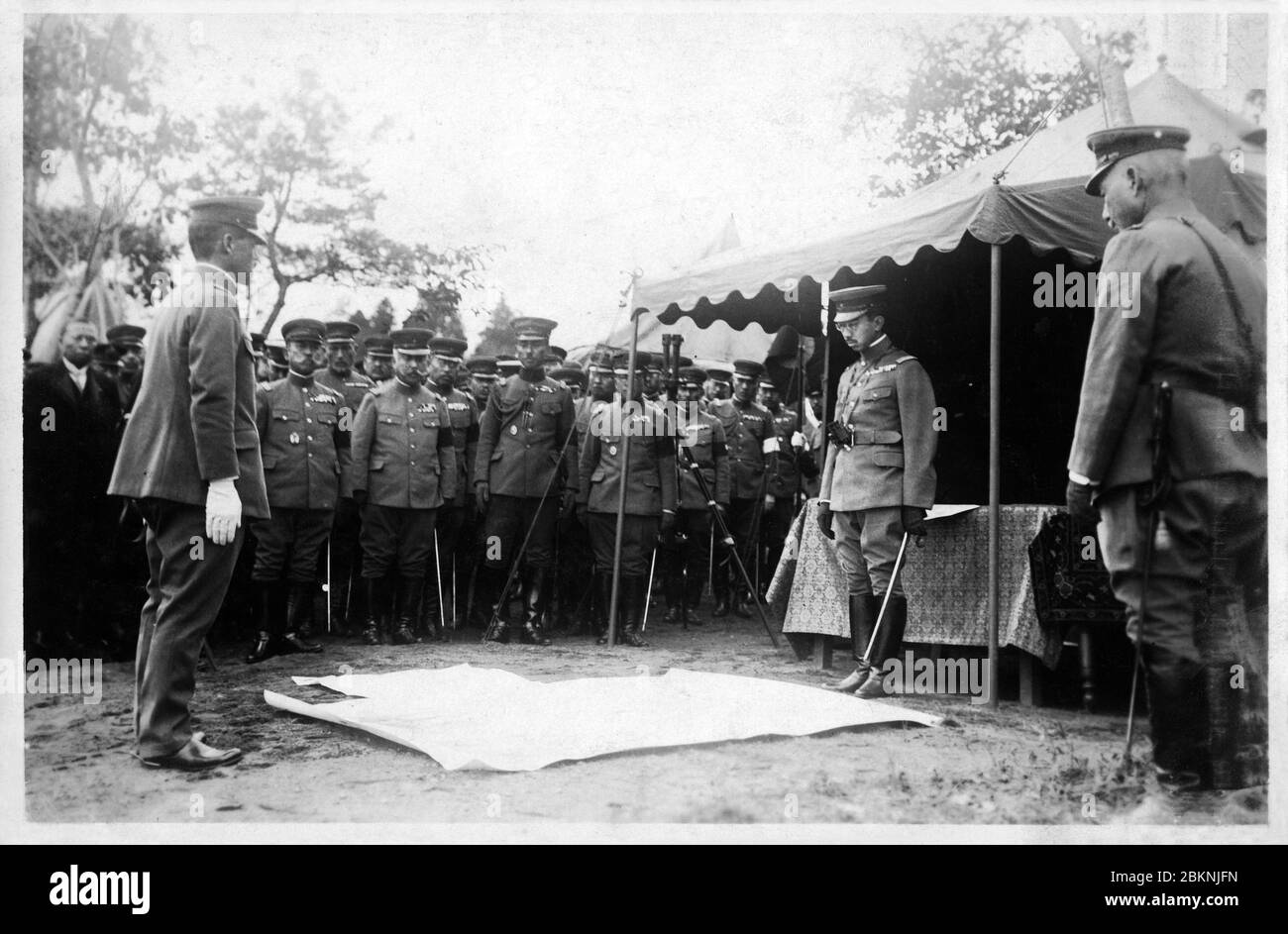 [ 1920s Japan - Japanese Emperor Hirohito ] —   Emperor Showa (Hirohito) observes maneuvers (大演習, daienshuu) of the Imperial Guard.   From a private photo album of a member of the Japanese Imperial Guard (近衛師団, Konoe Shidan) who served between 1928 (Showa 3) and 1930 (Showa 5).  20th century gelatin silver print. Stock Photo