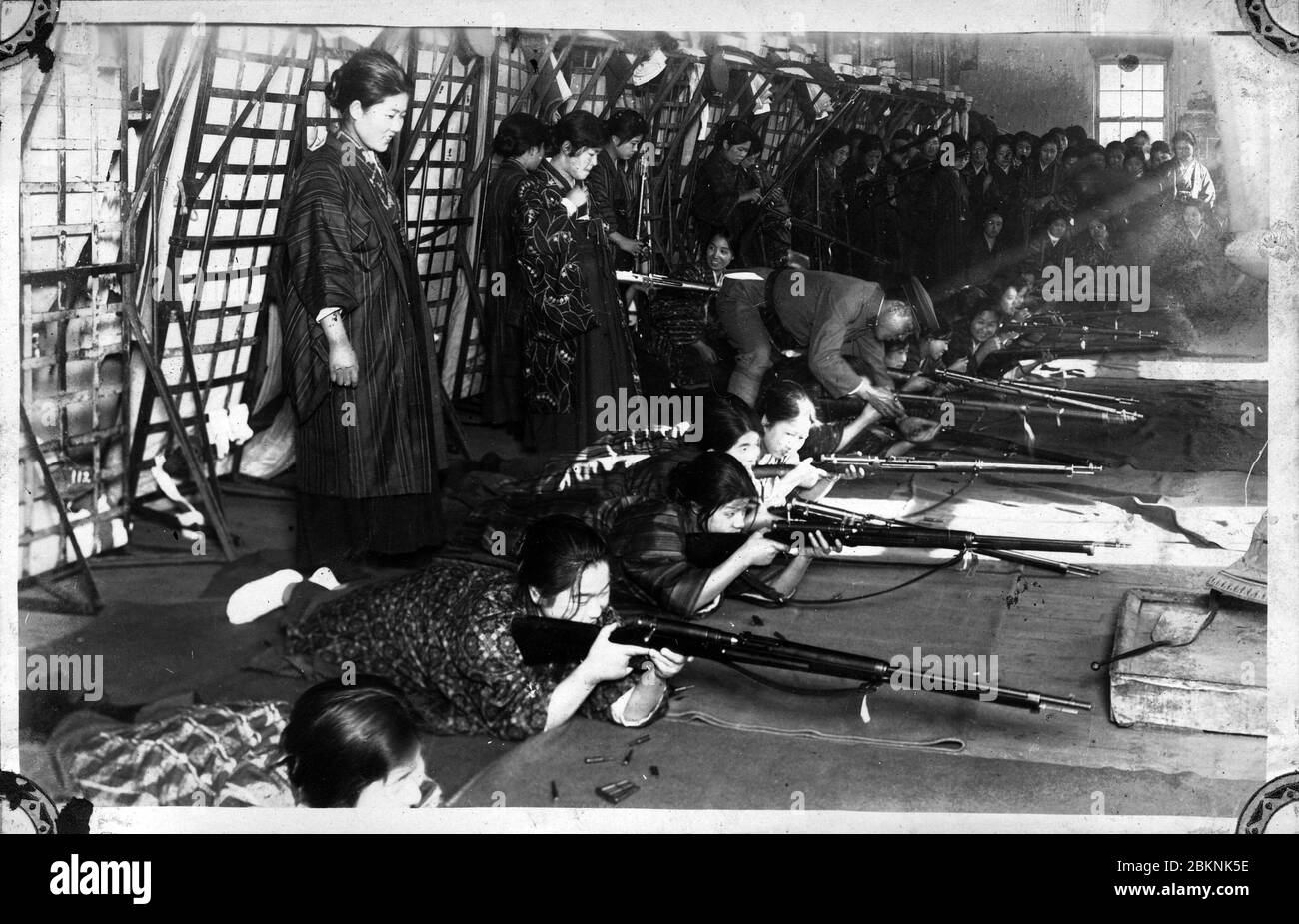 [ 1920s Japan - Rifle Practice for Japanese Women ] —   Women in kimono participate in rifle practice.  From a private photo album of a member of the Japanese Imperial Guard (近衛師団, Konoe Shidan) who served between 1928 (Showa 3) and 1930 (Showa 5).  20th century gelatin silver print. Stock Photo
