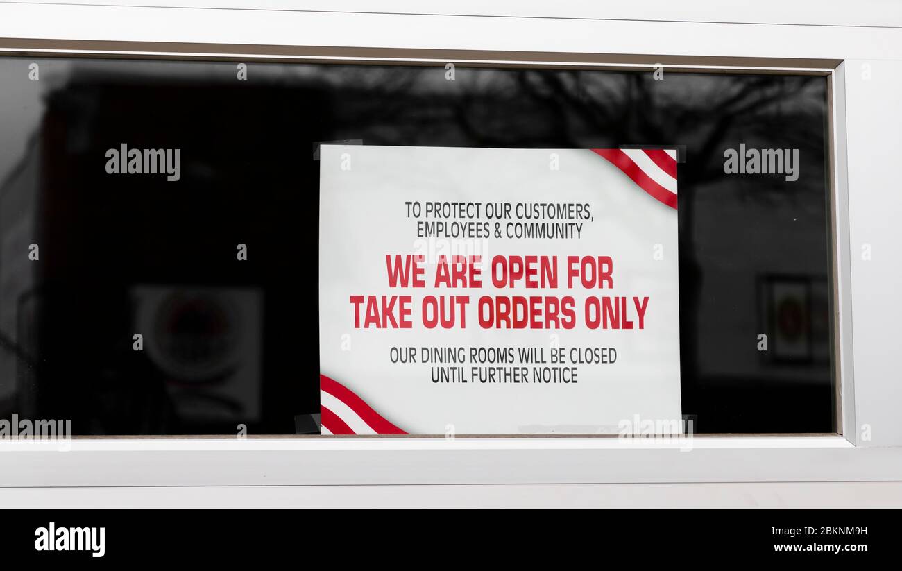 To protect our customers, employees and community we are open for take out orders only sign in window of restarant due to the Coronavirus COVID 19 pan Stock Photo