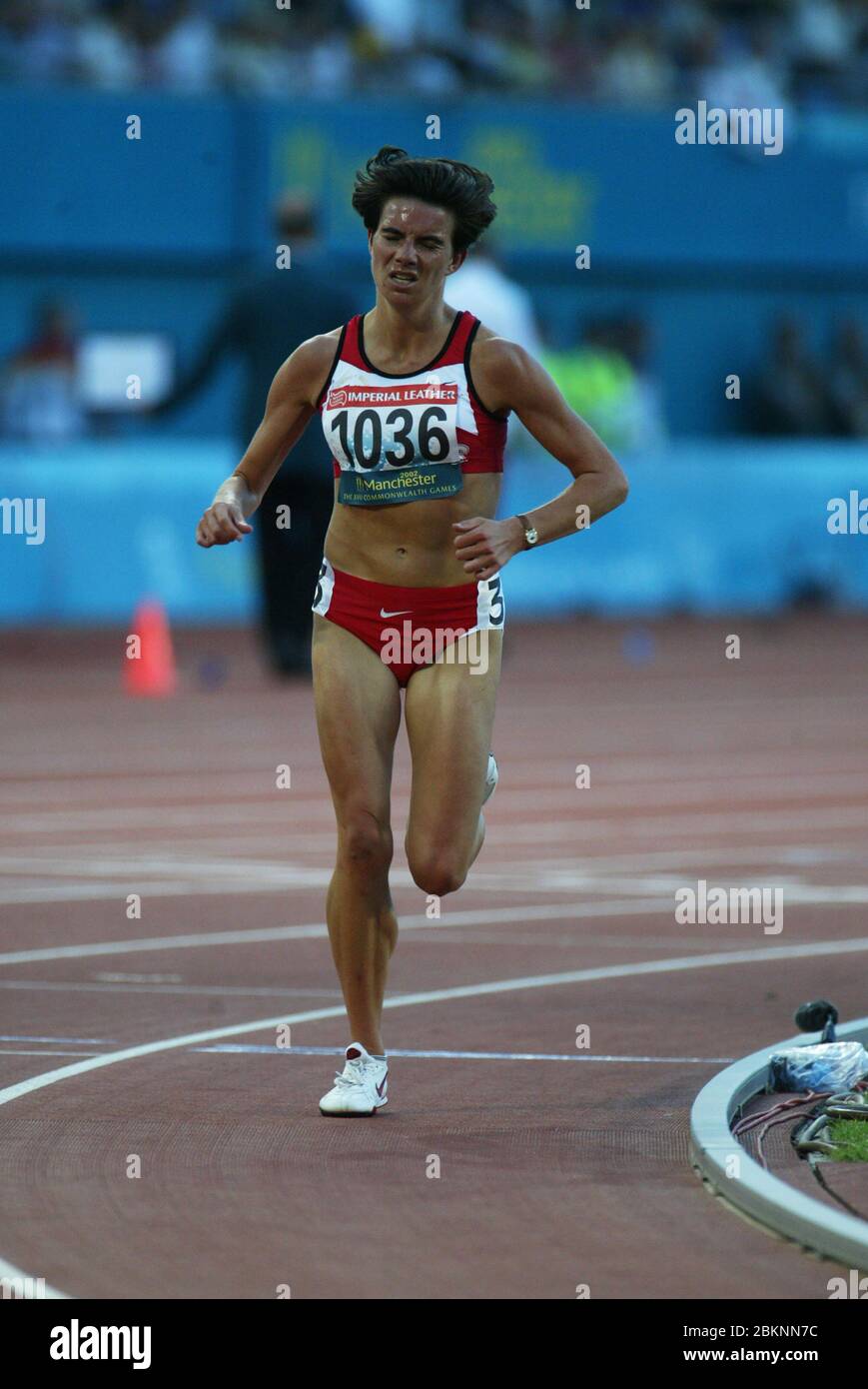 MANCHESTER - JULY 28: Catherine DUGDALE of Wales compete in Women's 5000m Final at City of Manchester Stadium during the 2002 Commonwealth Games, Manc Stock Photo