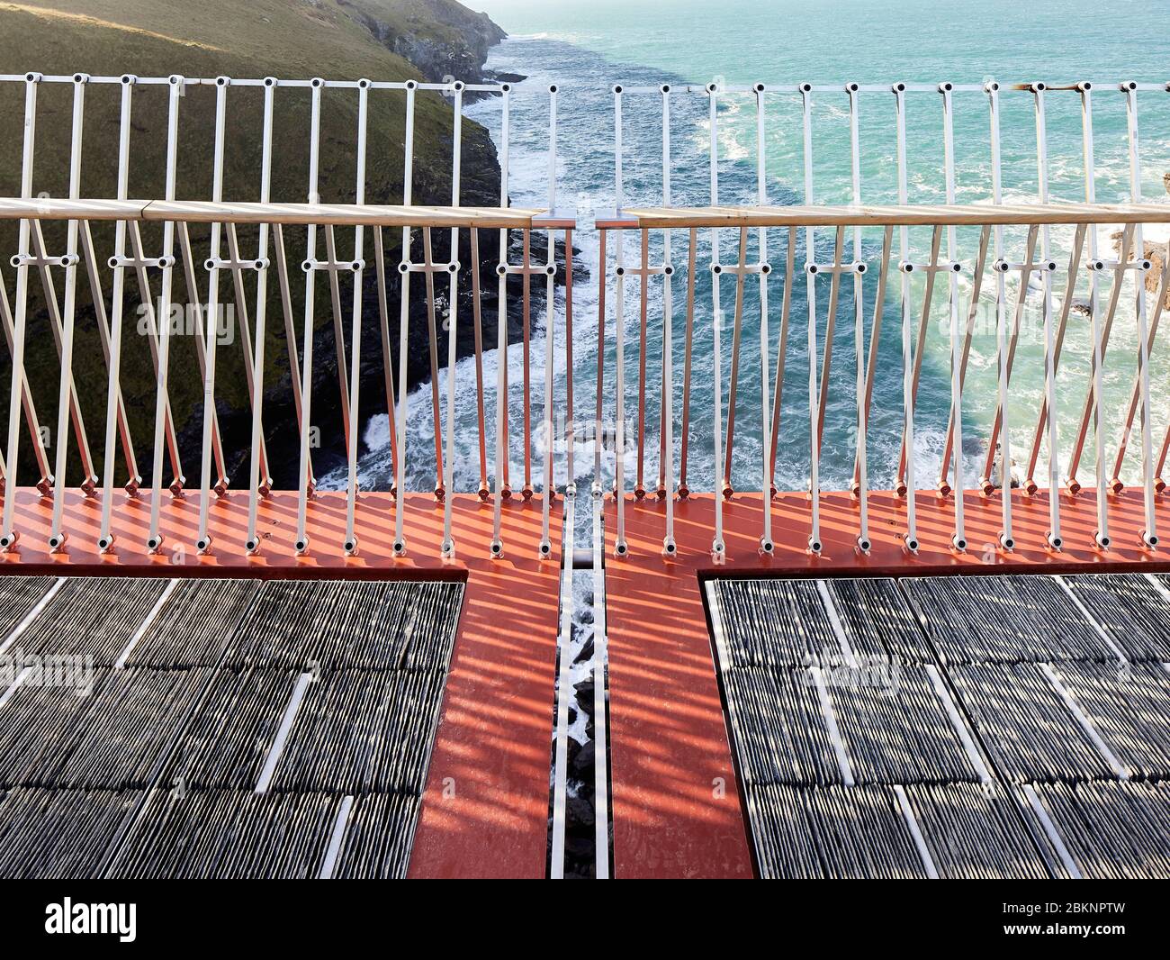 View of centre of bridge with 40-millimetre gap and slate pathway. Tintagel  Bridge, Tintagel, United Kingdom. Architect: William Matthews Associates  Stock Photo - Alamy