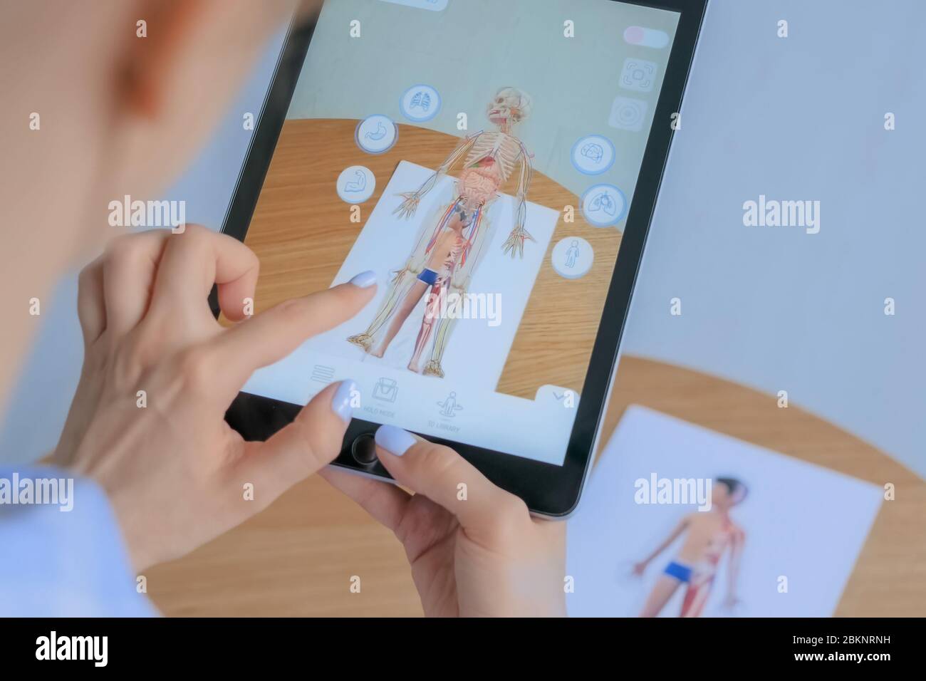 MOSCOW, RUSSIA - AUGUST 1, 2019. Woman using tablet with augmented ...