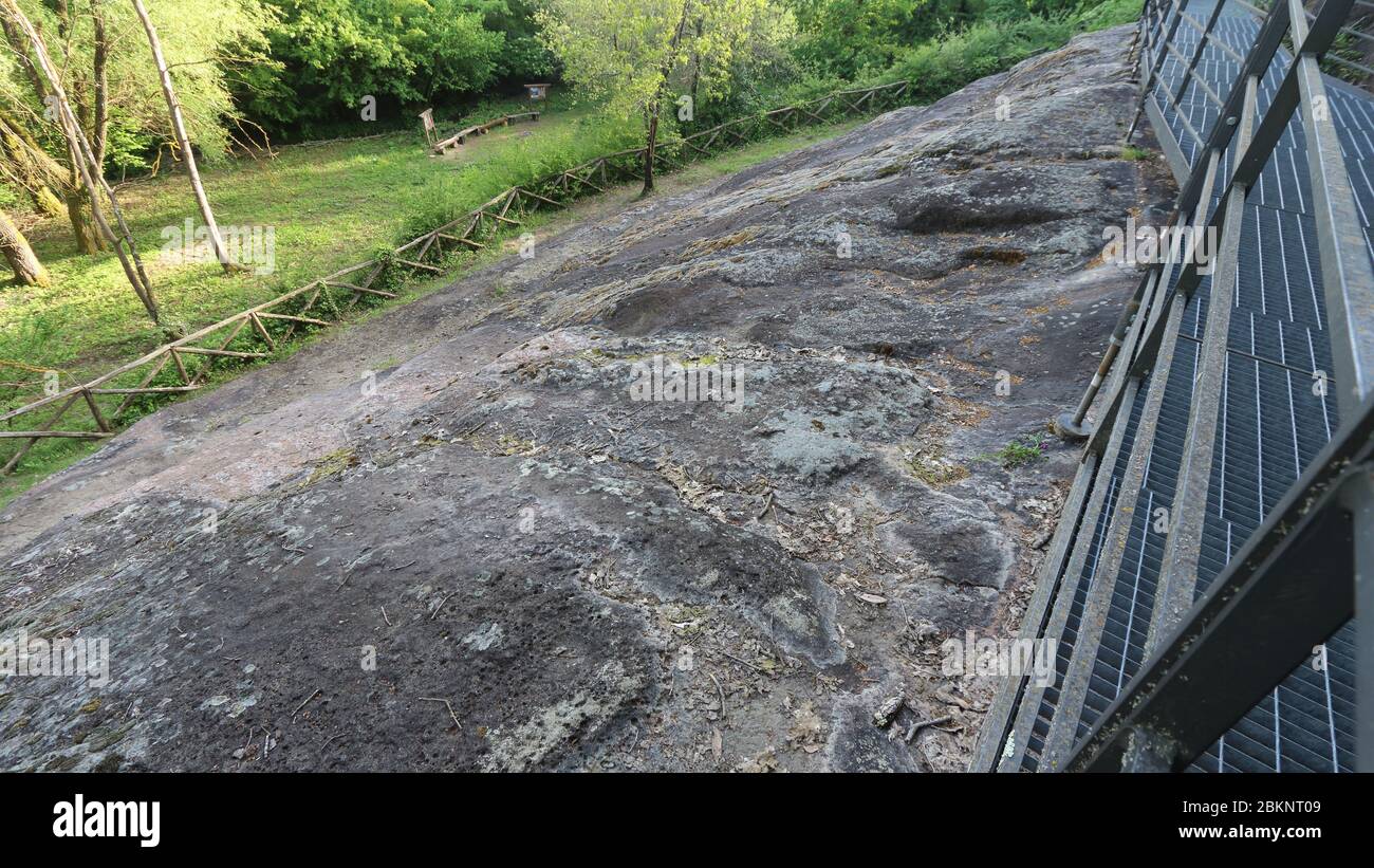 Tora e Piccilli, Italy - May 2, 2015: The fossil human footprints of the paleontological site of the 'Ciampate del Diavolo' in the locality of Foresta Stock Photo