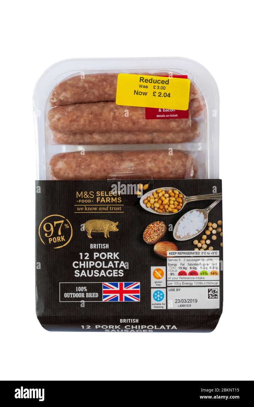 pack of British 12 Pork Chipolata Sausages M&S select farms we know and trust 97% pork 100% outdoor bred isolated on white background price reduction Stock Photo