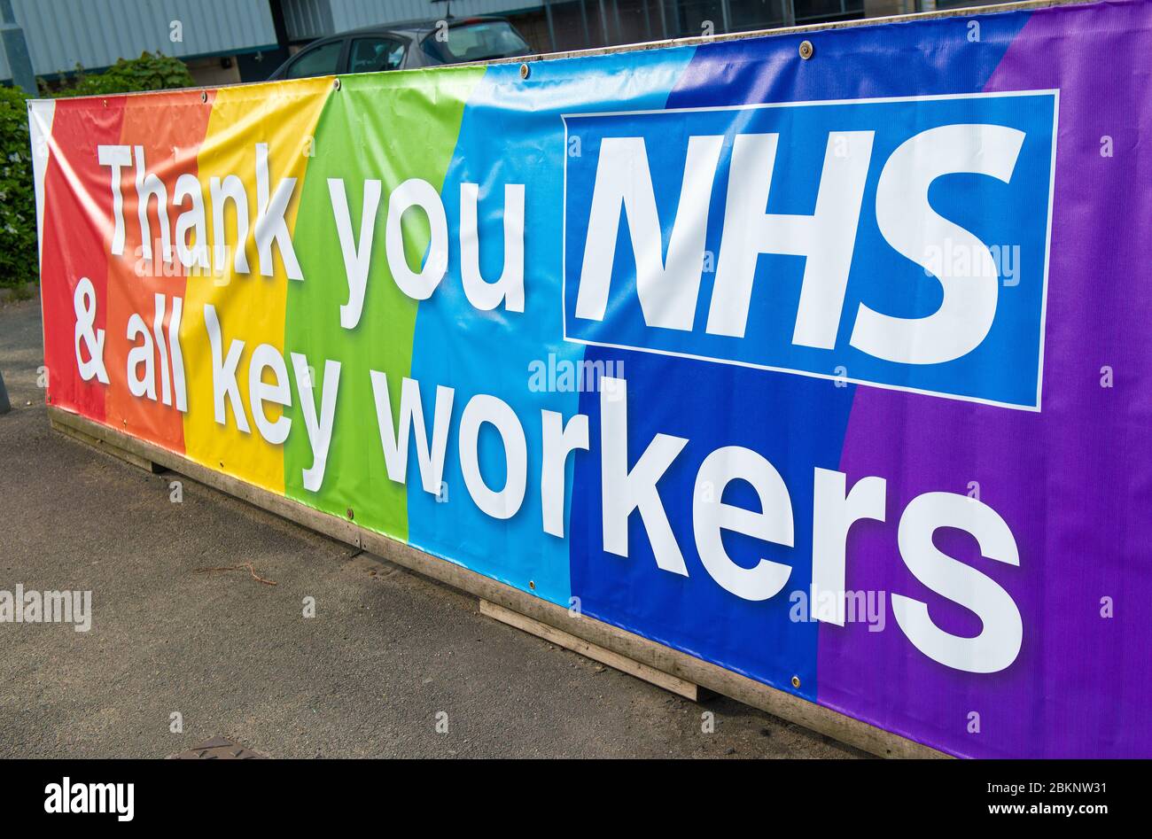 Large colourful rainbow banner, in gratitude to all NHS medical staff and keyworkers who are working during the UK Coronavirus pandemic crisis. Stock Photo