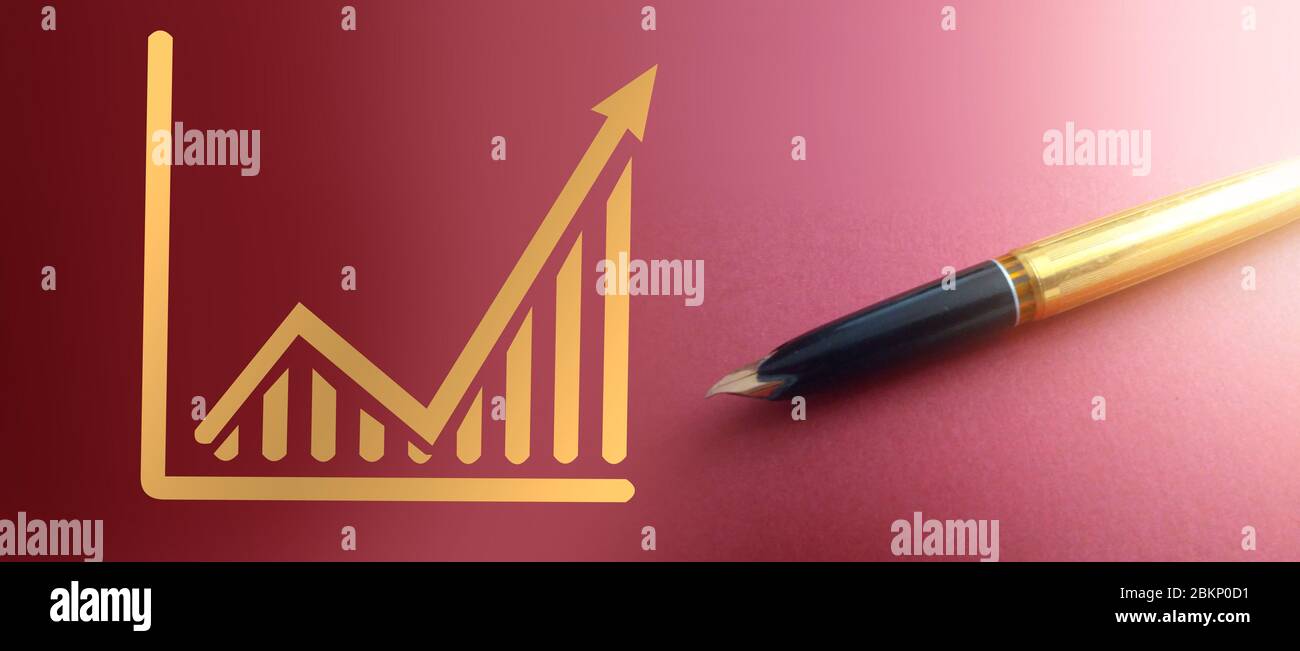 Graphs going up and and luxury vintage pen besides. Business success big profits value increase forecast concept Stock Photo