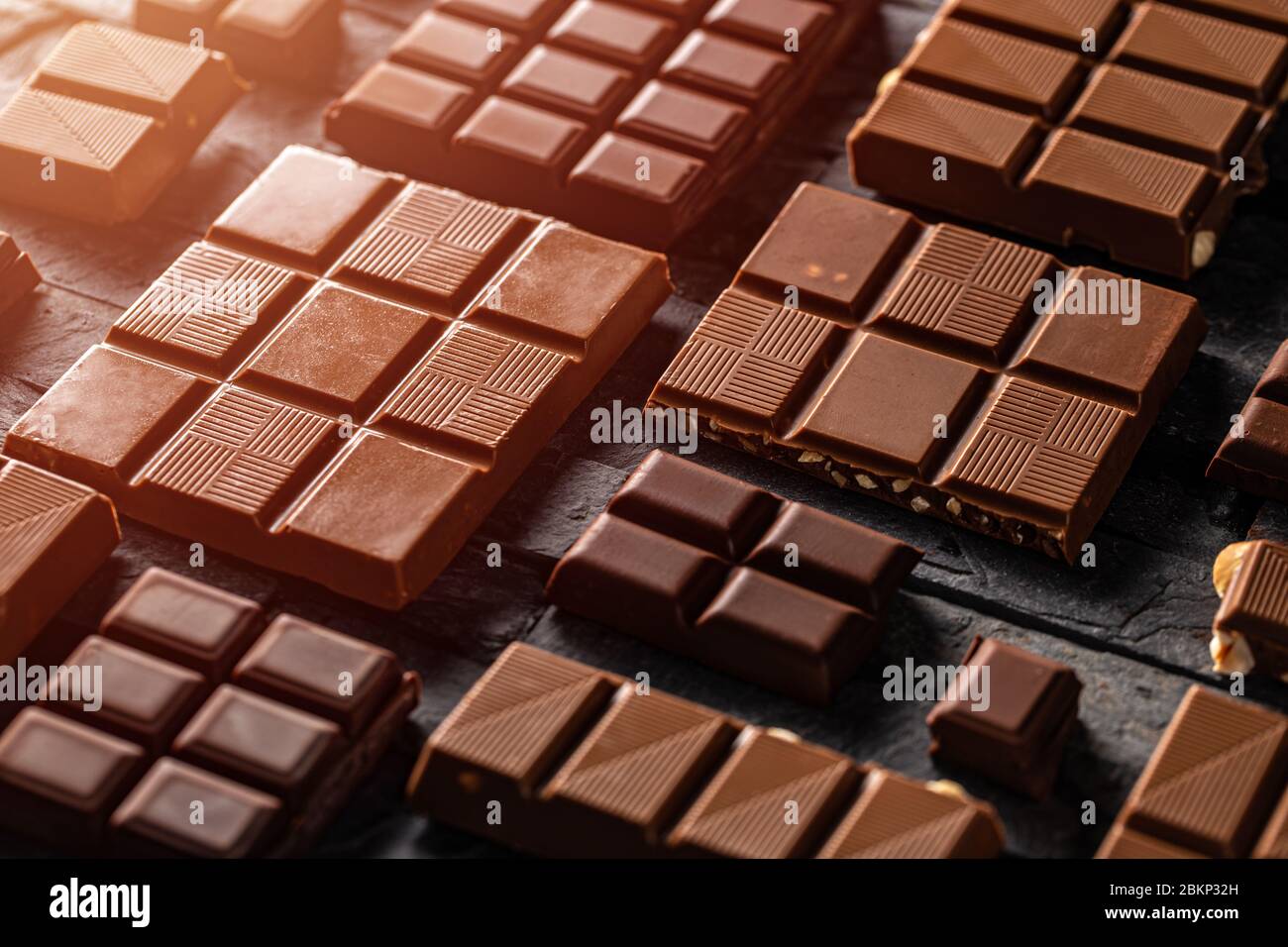 Chocolate bar pieces. Sweet food photo concept. Stock Photo