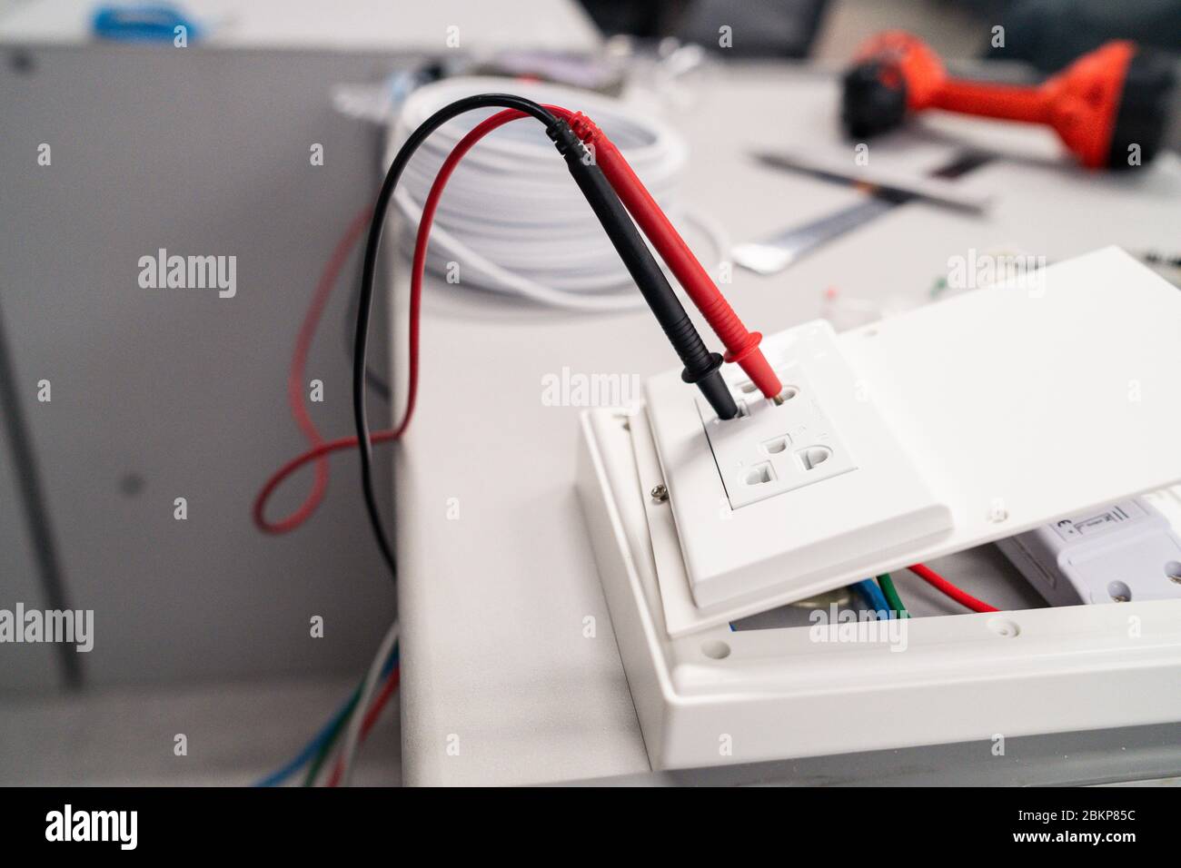 Digital multi meter to test measure the voltage at the power outlet on