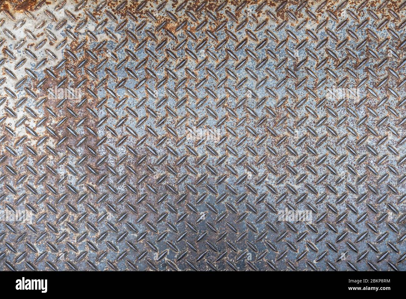 Old and rusted Metal diamond plate pattern texture, background Stock Photo