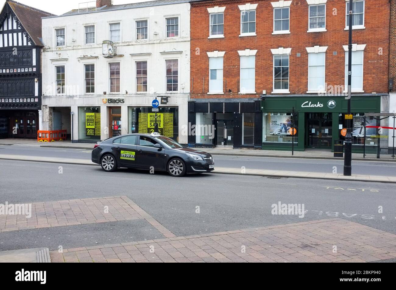 A lone taxi waits for a fare in a deserted Salisbury Street on market day during the coronavirus pandemic in 2020. Stock Photo