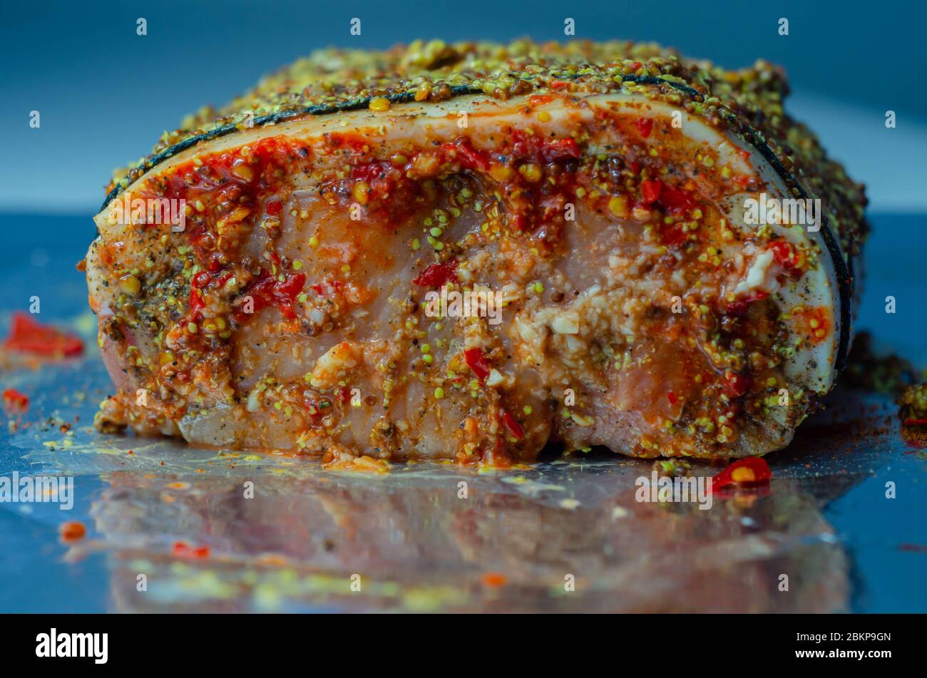 Boneless British rindon pork loin joint, prepared in marinades