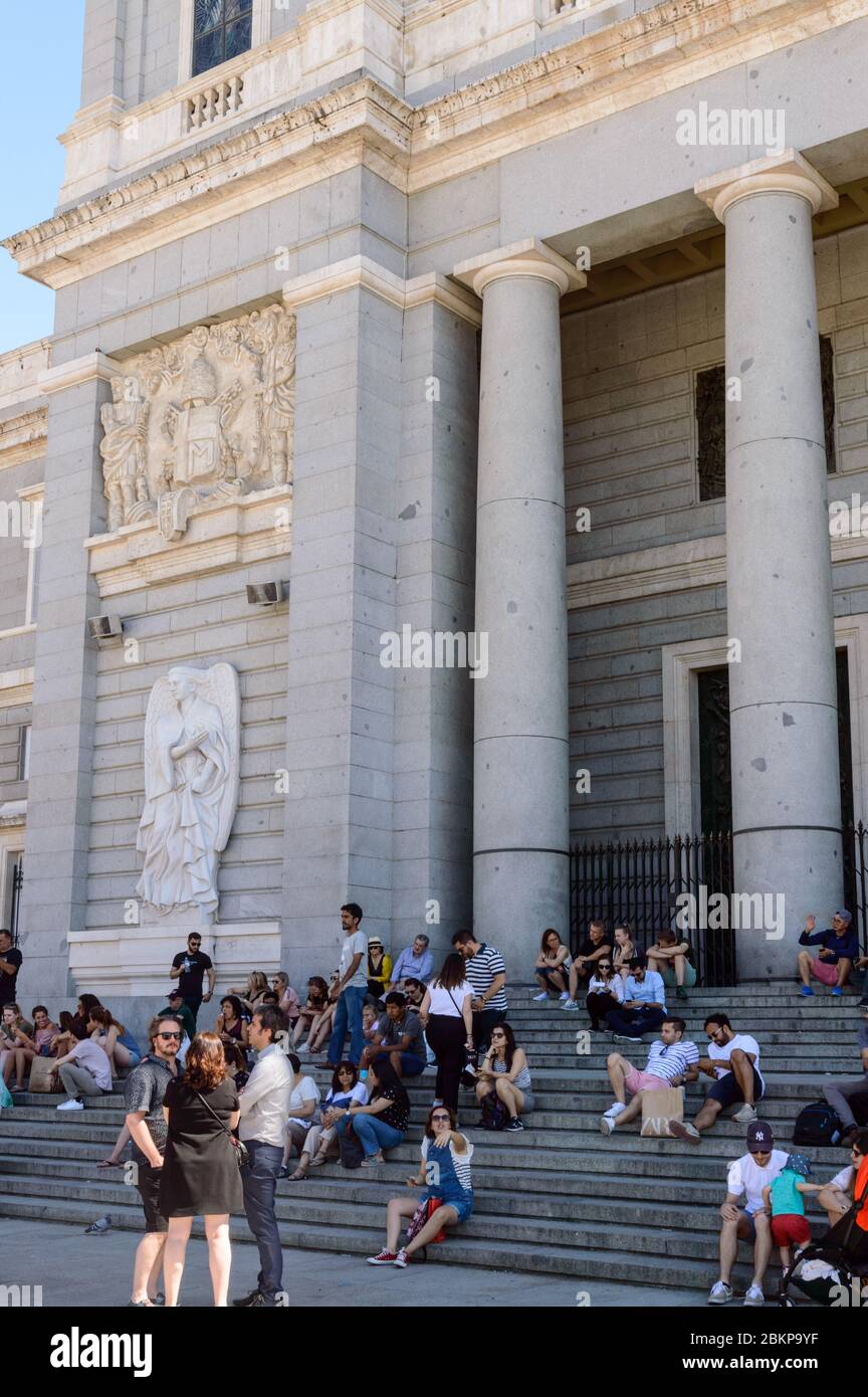 Rest place for tourists on the stairs of the Almudena cathedral. June 15, 2019. Madrid. Spain. Travel Tourism Holidays Stock Photo