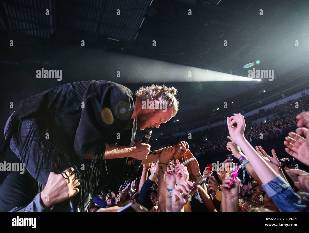 Singer Dan Reynolds, of Imagine Dragons as the band performs live at the First Direct Arena in Leeds, West Yorkshire, UK to promote their album, Smoke Stock Photo