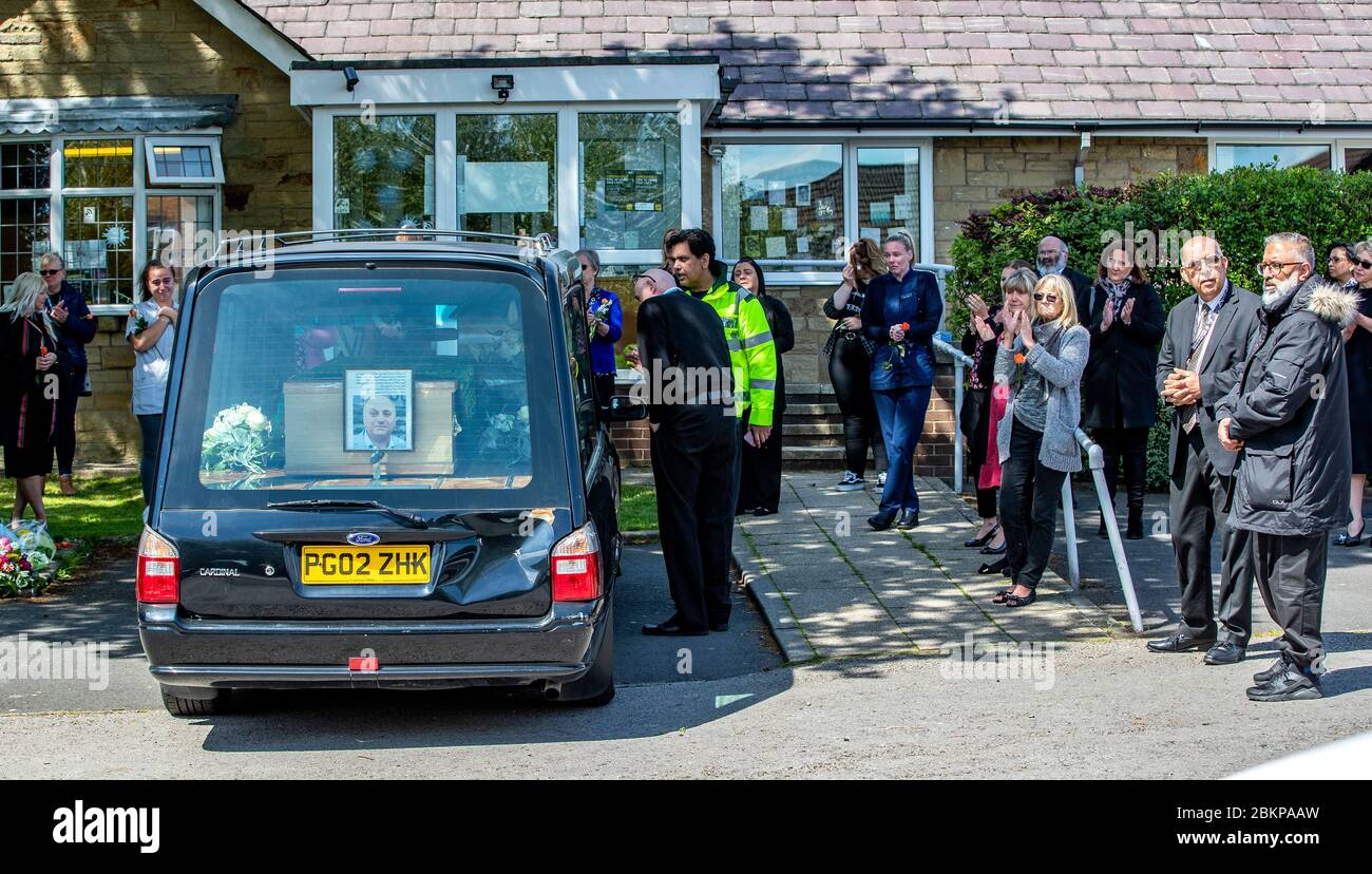 The hearse carrying the body of Dr AlDubbaisi passes Garden City