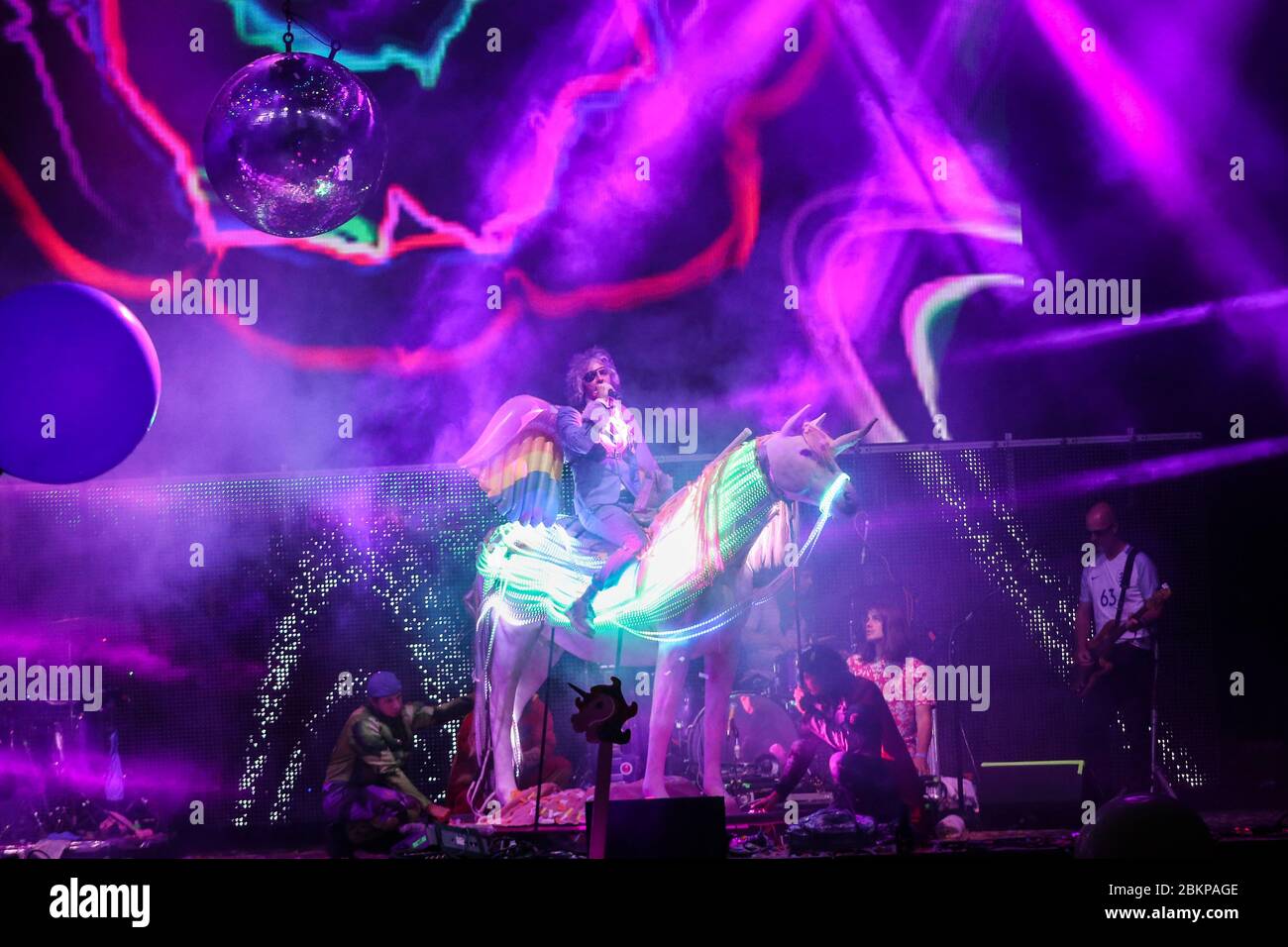 Singer Wayne Coyne of the Flaming Lips sits atop a large unicorn, as the band performs at the 2018 Bluedot Festival held at Jodrell Bank in Cheshire, Stock Photo