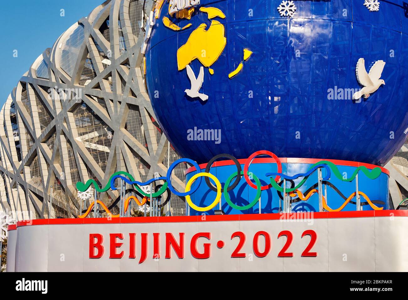 Beijing / China - February 20th 2016: Decorative stand promoting the Beijing Winter Olympic 2022 in front of the Beijing National Stadium Birds Nest i Stock Photo