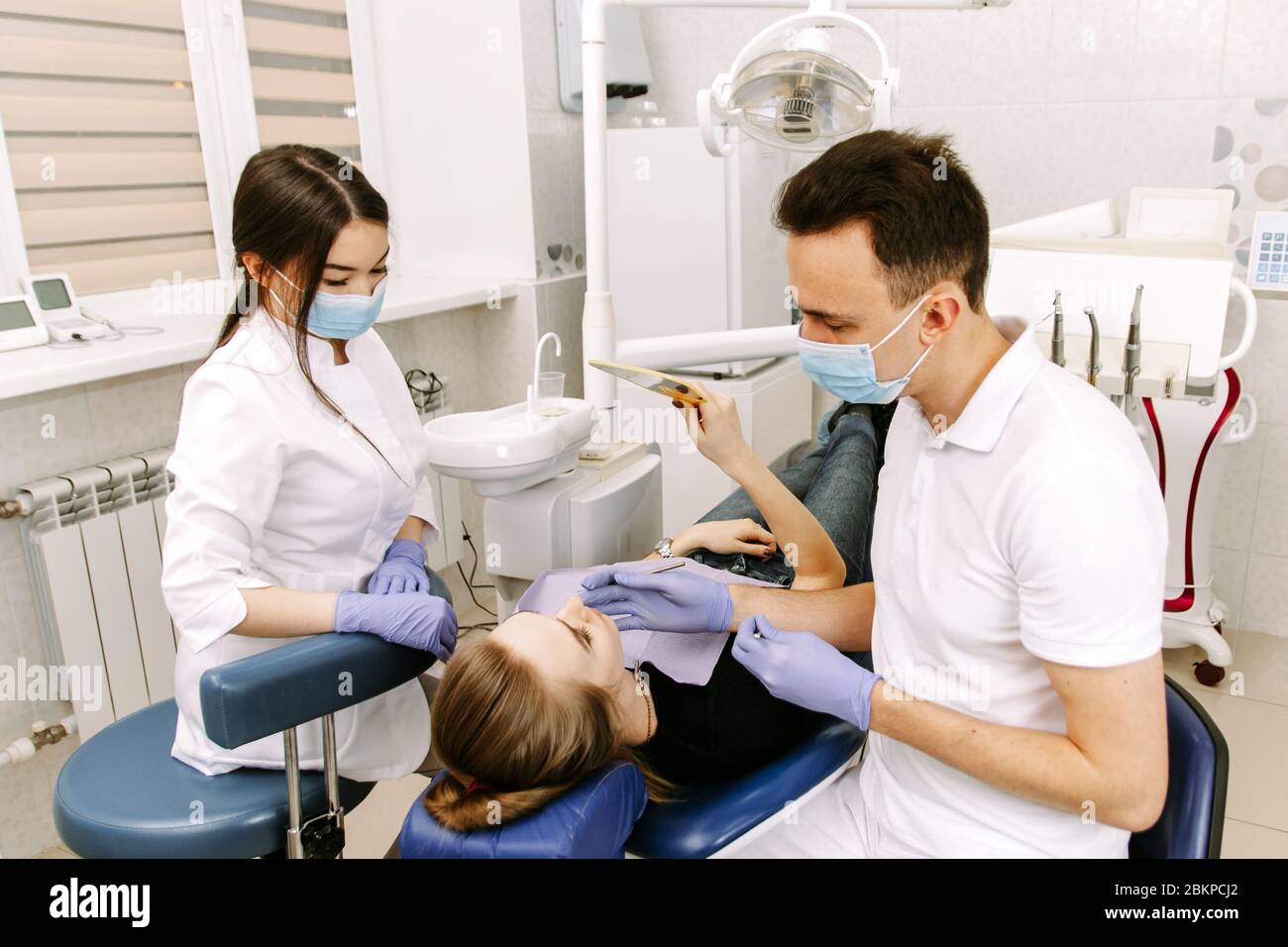 Dentist drilling tooth young patient hires stock photography and