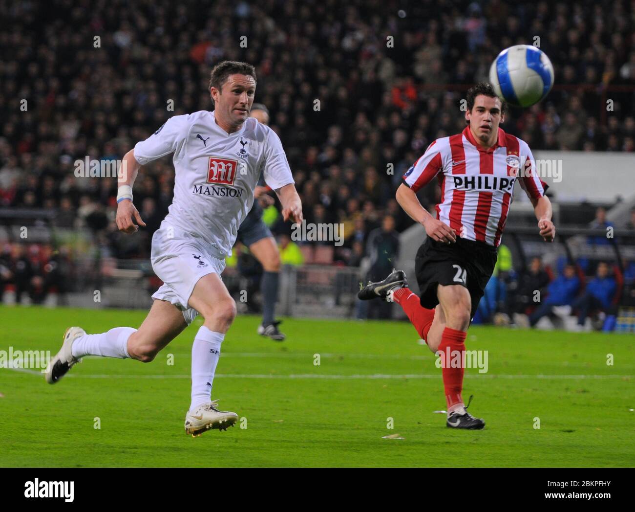 EINDHOVEN, NEDERLAND. MARCH 12: Robbie Keane of Tottenham Hotspur During UEFA Cup Round of 16 Second Leg between PSV Eindhoven and Tottenham Hotspur a Stock Photo