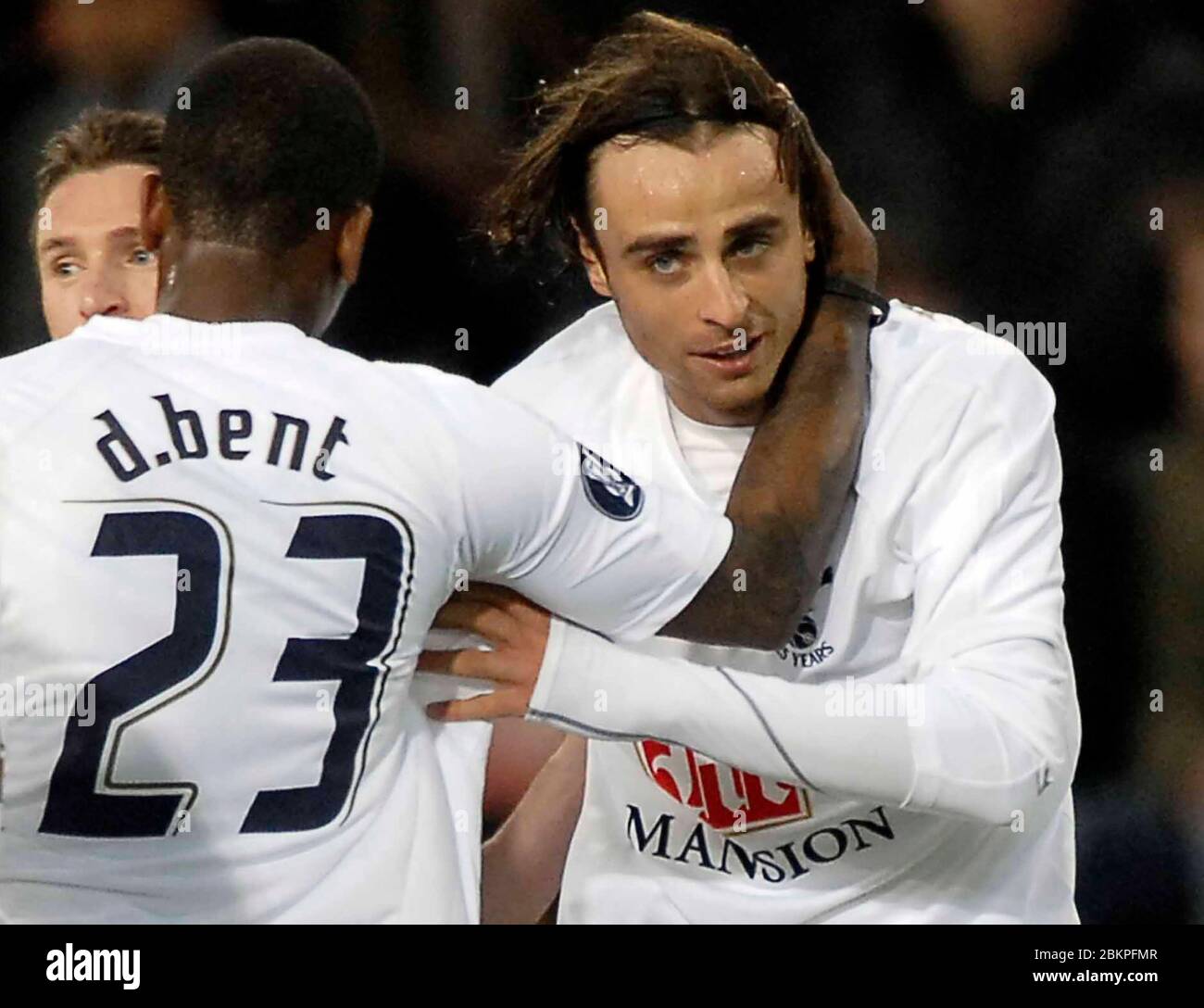 EINDHOVEN, NEDERLAND. MARCH 12: Darren Bent (Spurs) congratulates Dimitar Berbatov (Spurs, right) on his goal. During UEFA Cup Round of 16 Second Leg Stock Photo