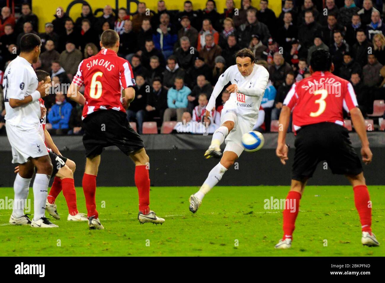 EINDHOVEN, NEDERLAND. MARCH 12: Dimitar Berbatov (Spurs) shoots to score the first goal During UEFA Cup Round of 16 Second Leg between PSV Eindhoven a Stock Photo