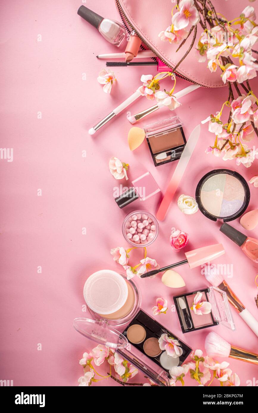 Makeup products with cosmetic bag and spring flowers. Professional Makeup  set flatlay. Set of decorative cosmetics on tender pink background. Copy  spa Stock Photo - Alamy, image size:867x1390