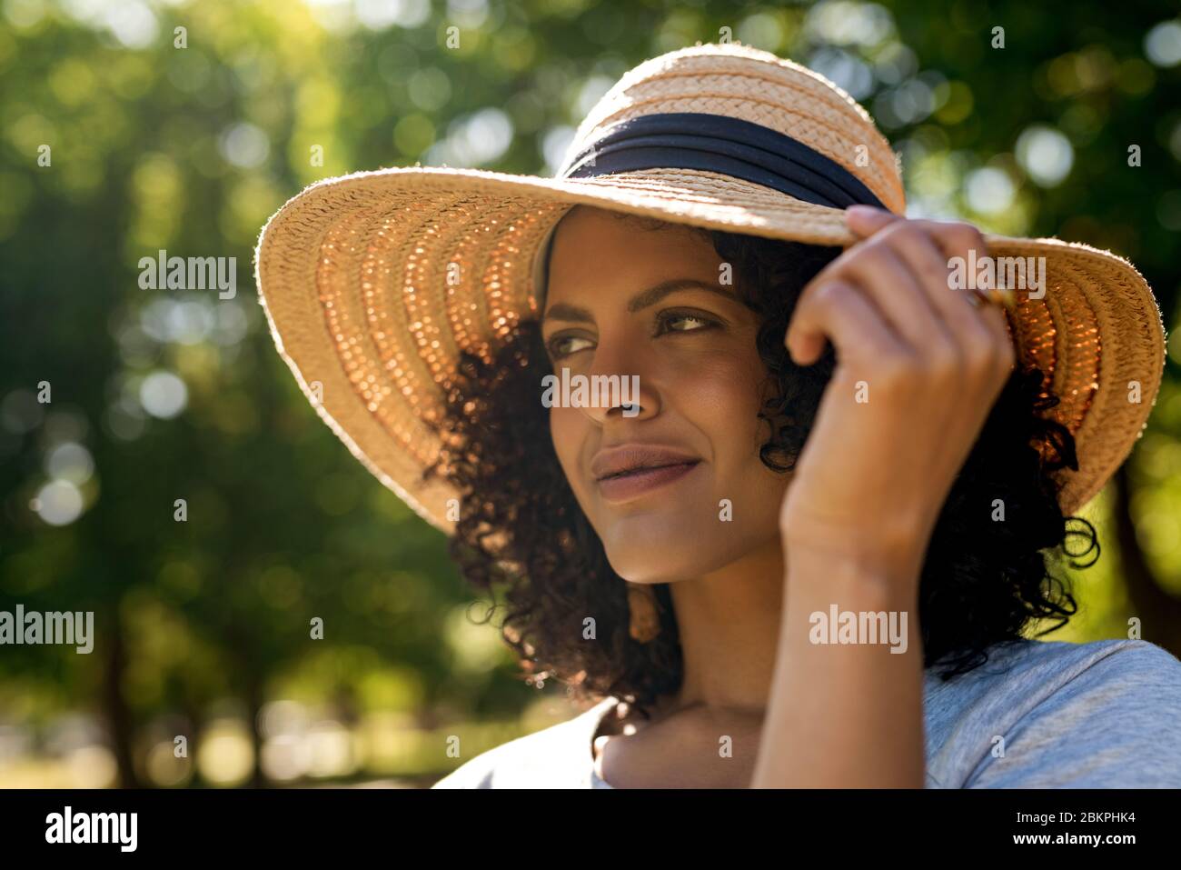 Woman standing wearing hat hi-res stock photography and images - Alamy