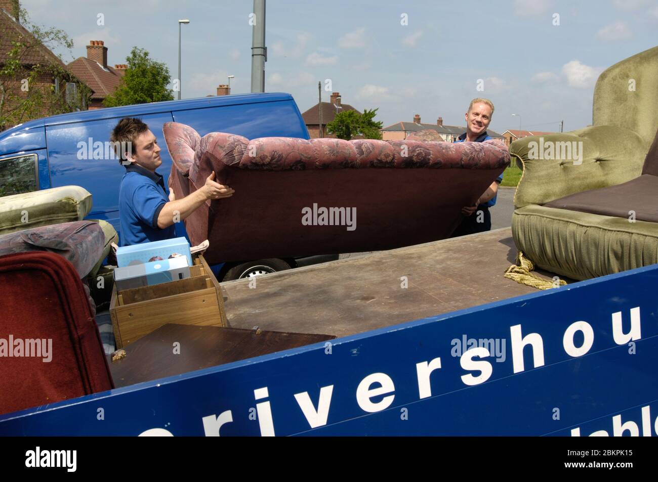 Housing Association staff throwing out old furniture from a house that