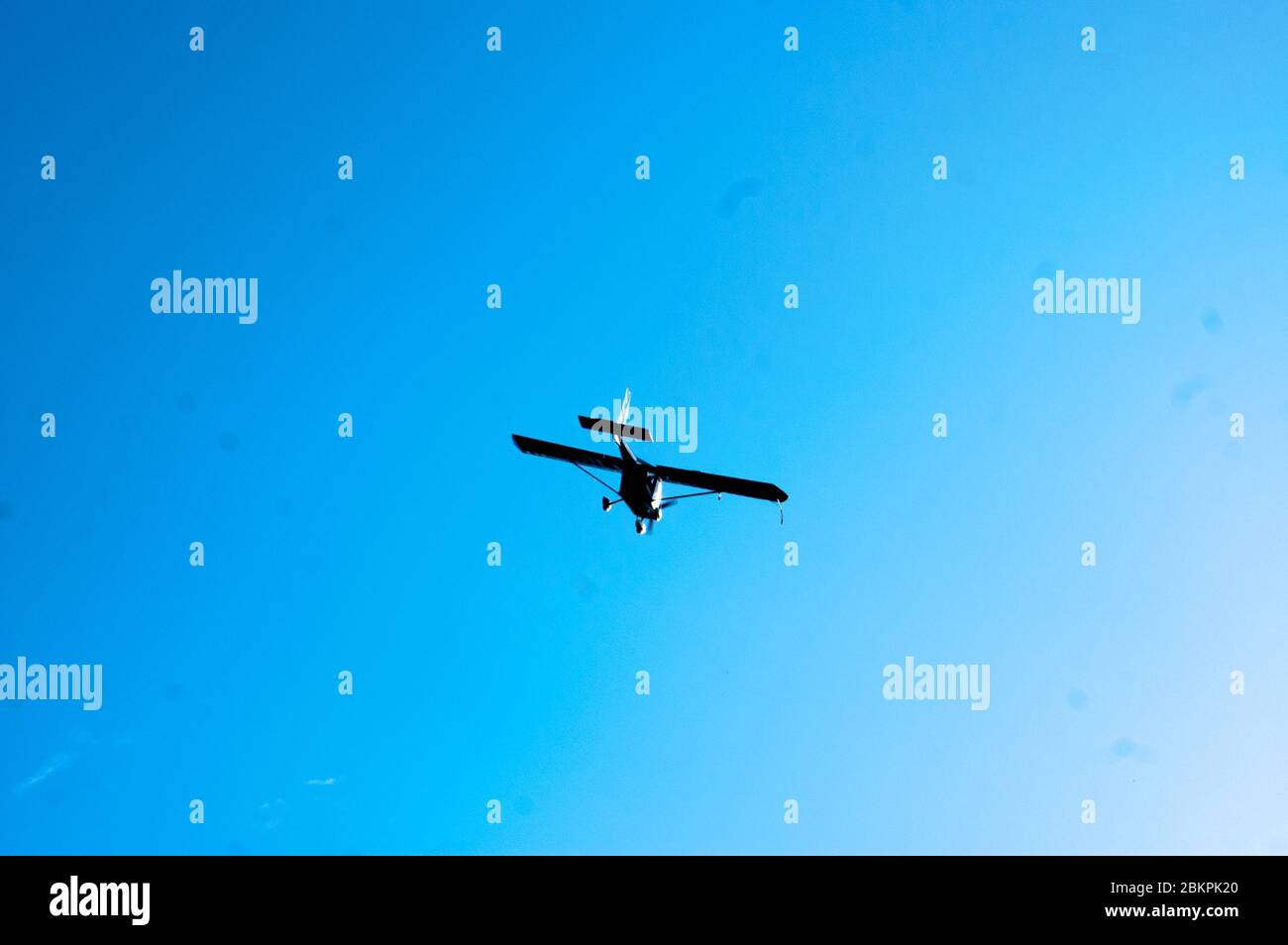 A small plane flying in the morning over the Annapurna Range Mountains of Himalayas. Tourist companies arrange this kind of rides in the early morning Stock Photo