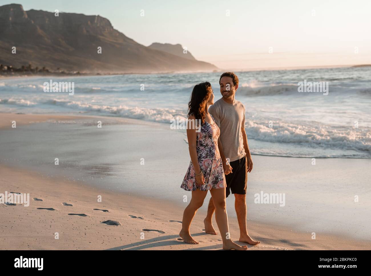 Happy young walking hand in hand hi-res stock photography and images ...