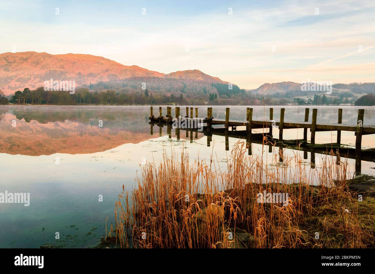 Early morning on Coniston Water, looking towards Yewdale Fells and Holme Fell Stock Photo