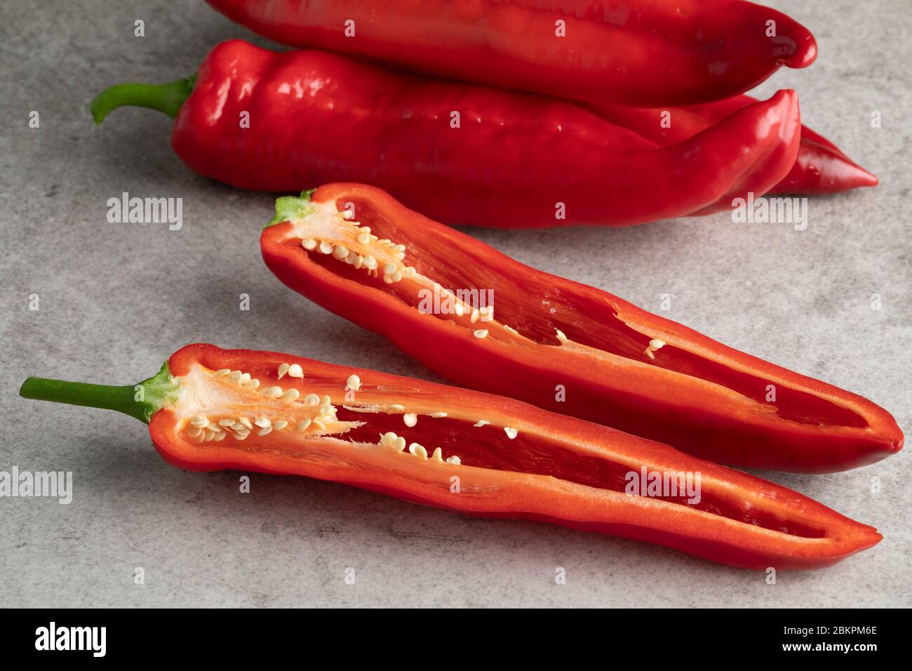 Sliced fresh red sweet pointed pepper close up Stock Photo