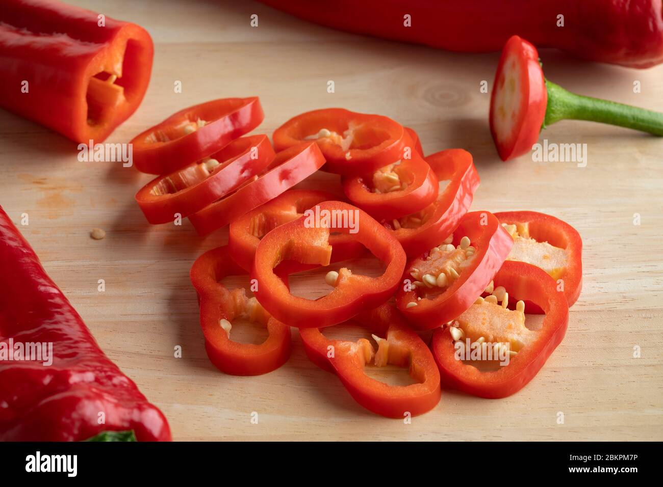 Slices of fresh red pointed peppers close up Stock Photo