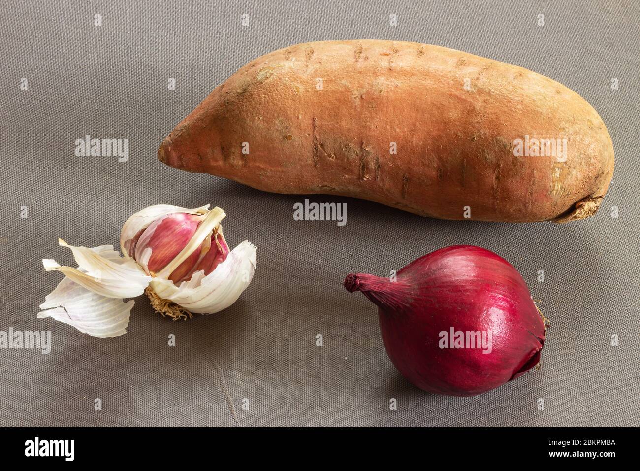 Sweet potato, onion and garlic Stock Photo Alamy