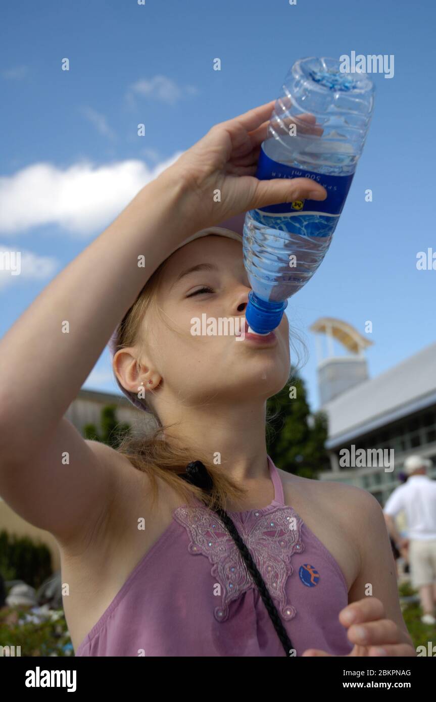 Girl drinking still bottled mineral water UK Stock Photo Alamy