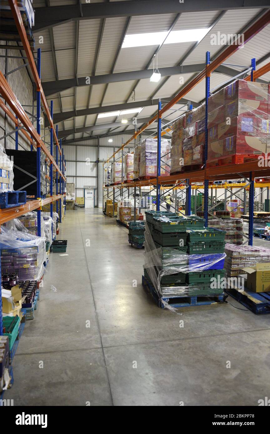 A large warehouse in the UK with supplies for a food bank Stock Photo