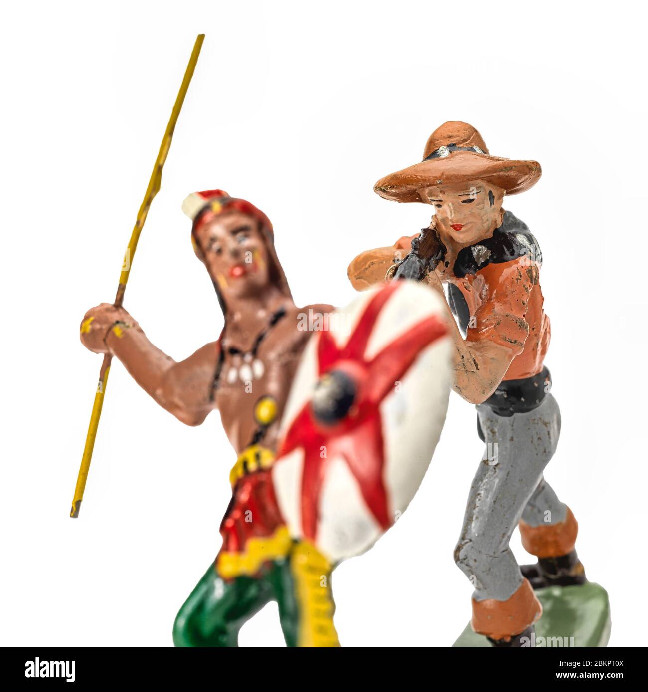 Cowboy shooting an Native American from the back. Toys Stock Photo