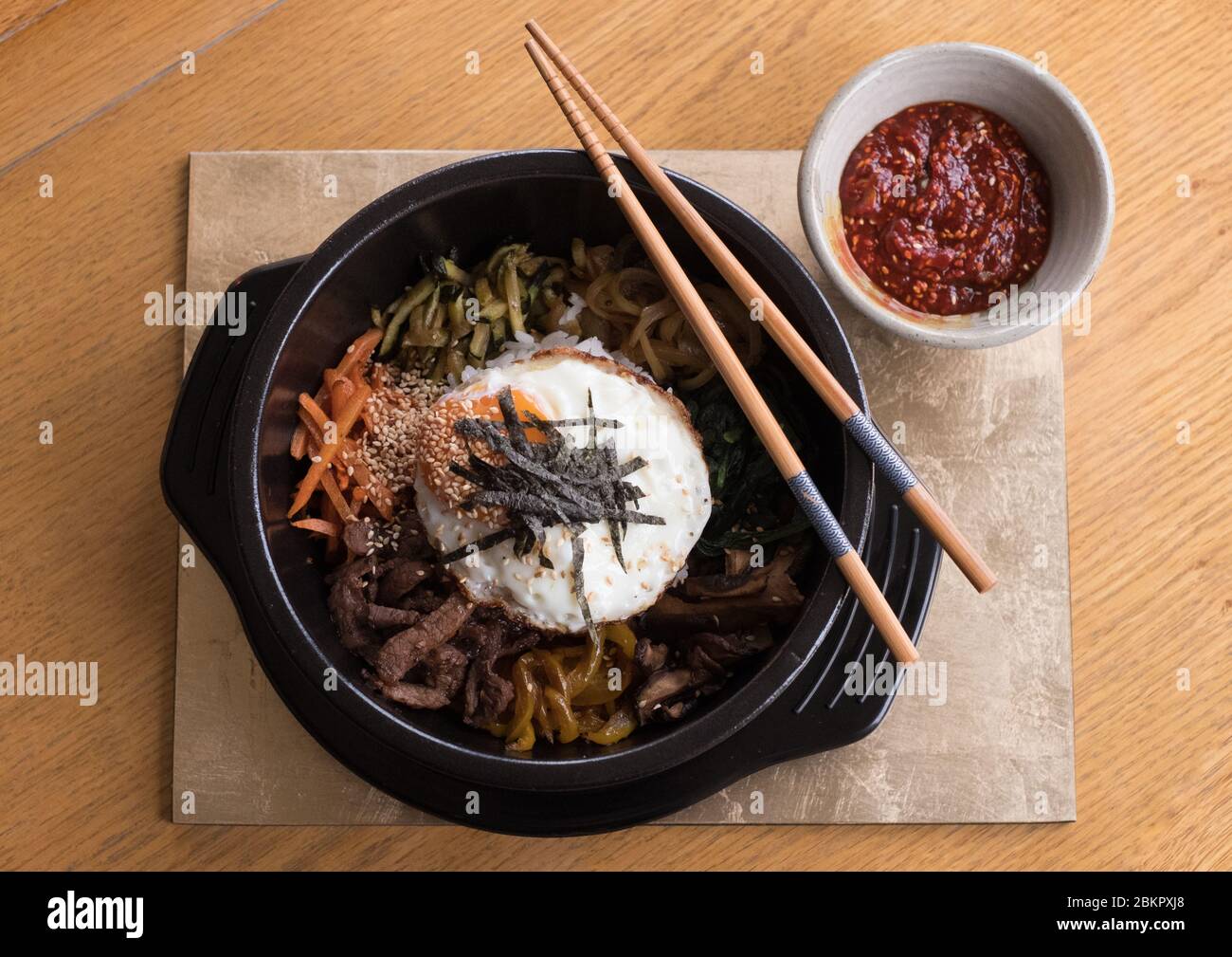 Korean Bibimbap (stir-fried beef and vegetables) served as supper main course at Smoo Lodge boutique B&B in Durness, Sutherland, Scotland Stock Photo