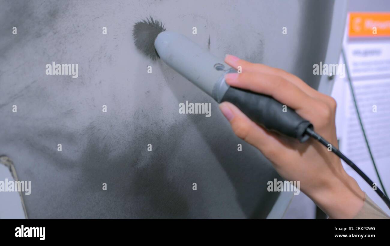 Interactive exposition in science museum woman with stick