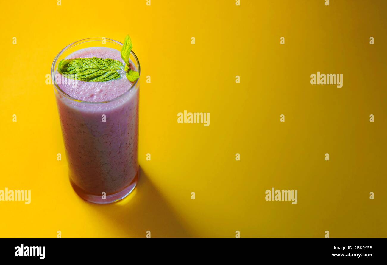 Download Minimal View Of Strawberry Smoothie Over Pastel Yellow Background Copy Space Stock Photo Alamy PSD Mockup Templates