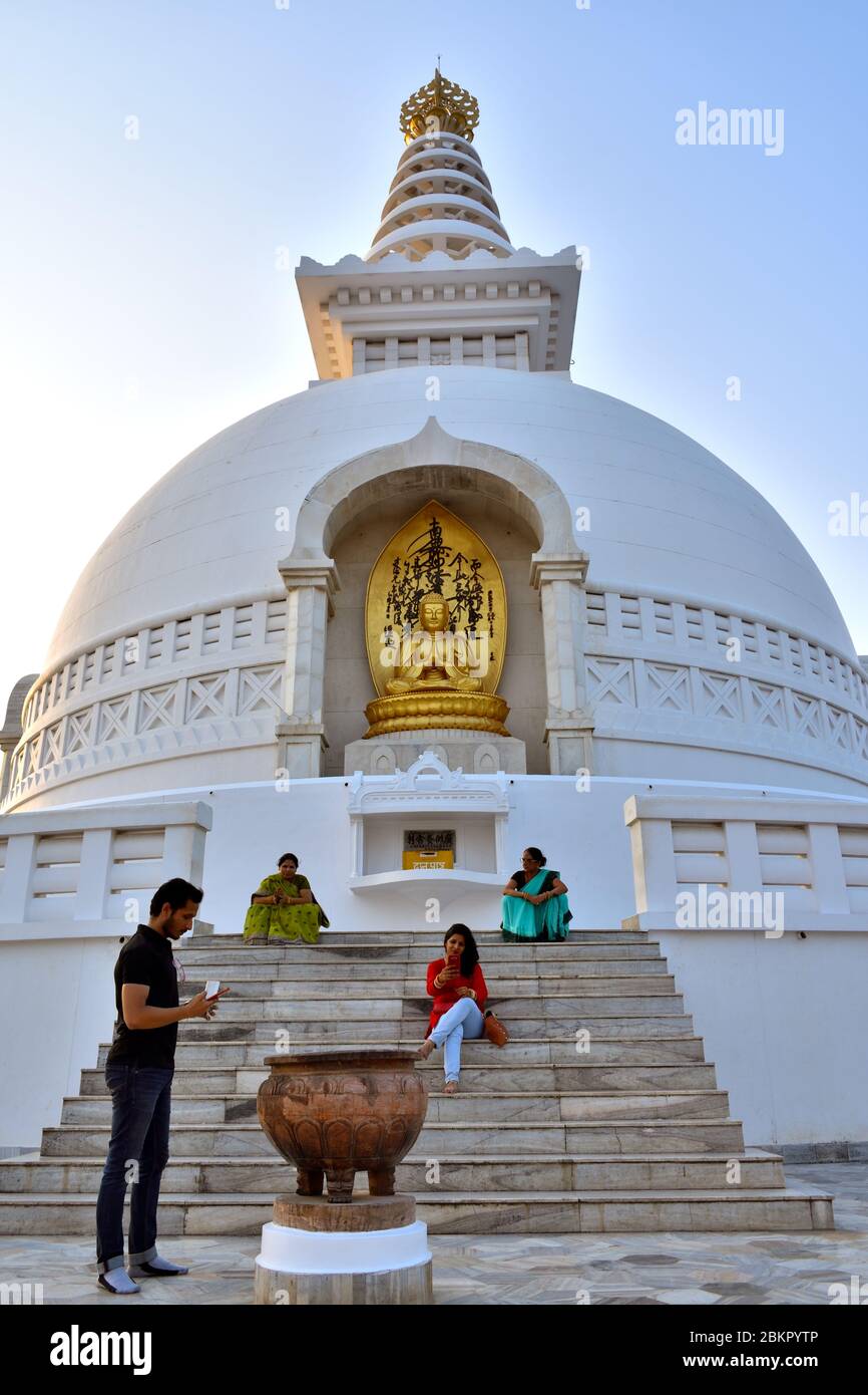 People pose for photographs at  the Buddha Stupa in Rajgir. Stock Photo