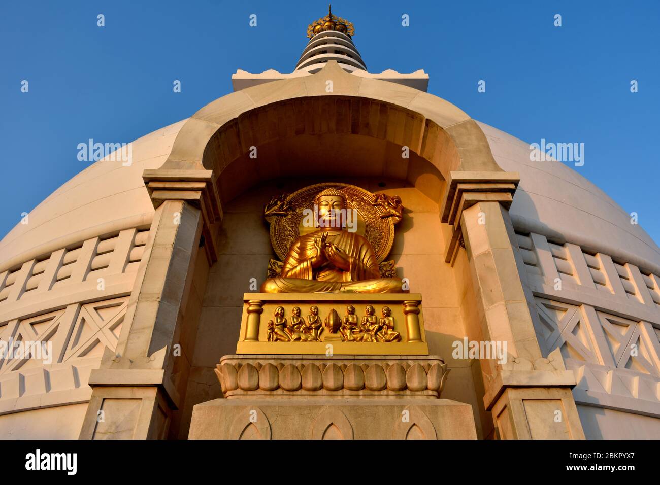 Evening light shining brightly on the Buddha Statue at Buddha Stupa in Rajgir. Stock Photo